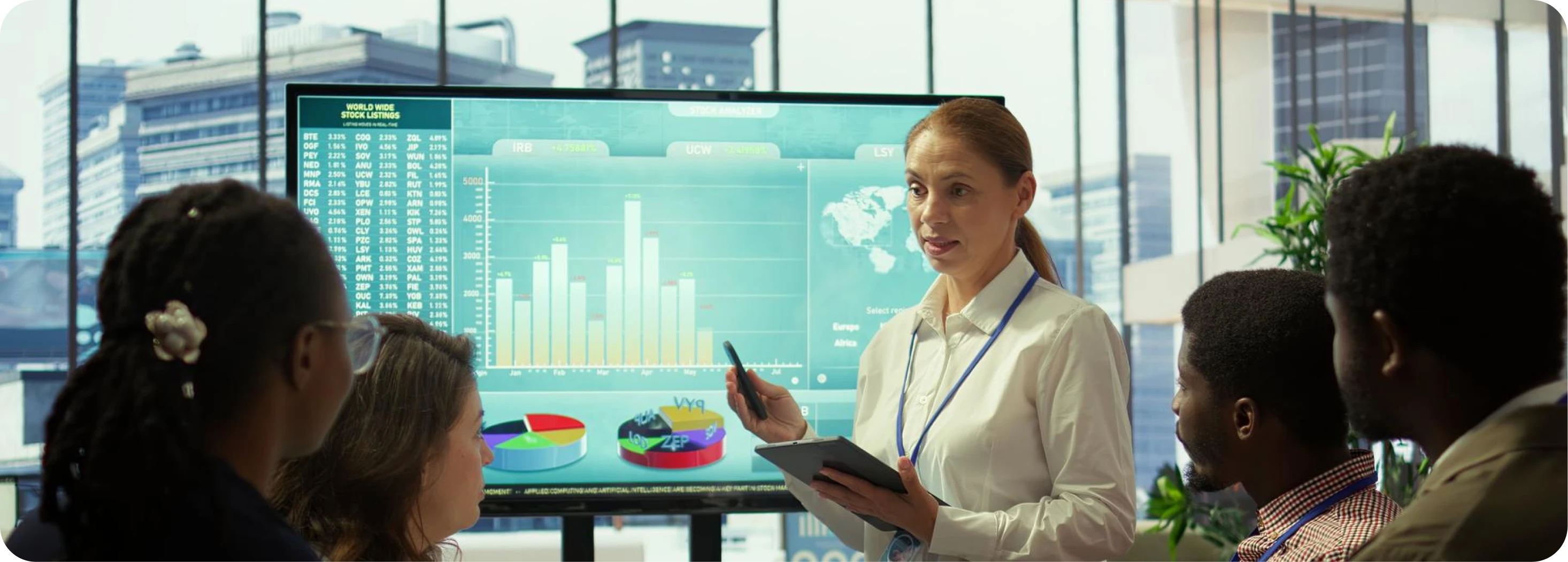Team collaborating around a data dashboard